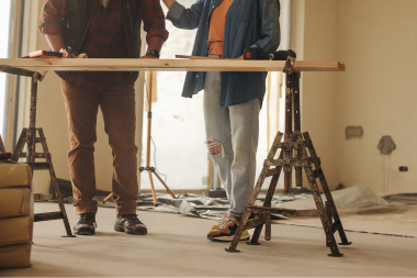 Greater Lansing home remodelers reviewing remodeling scope on desk