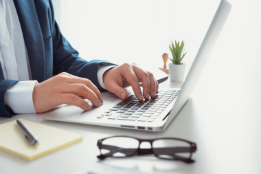 public adjuster on laptop in Greater Lansing Michigan