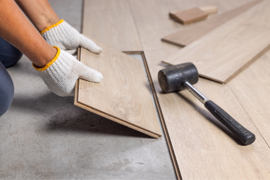 Greater Lansing home remodeling contractor installing luxury vinyl plank flooring