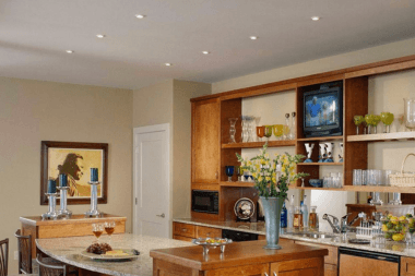 Greater Lansing basement remodeling project with recessed lighting and built in storage