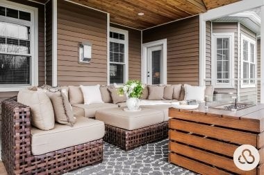 home addition project in Greater Lansing Michigan built by Custom Built Design and Remodeling with outdoor furniture and fire table