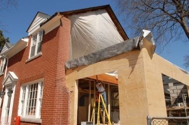 Greater Lansing home addition under construction with protective barrier