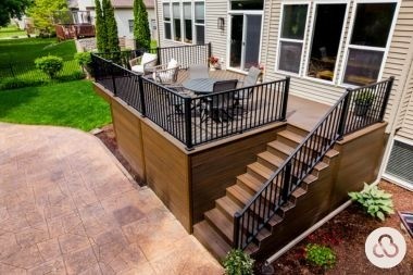 composite deck with stairs and railings in Grand Ledge Michigan built by Custom Built Design and Remodeling