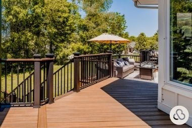 composite deck project in DeWitt Michigan built by Custom Built Design and Remodeling with aluminum railings and fire pit area
