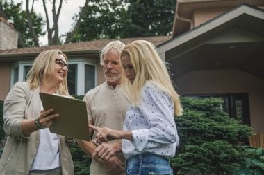 Greater Lansing homeowners discussing deck project with remodeler