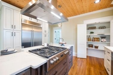 Greater Lansing kitchen with modern range and built in storage