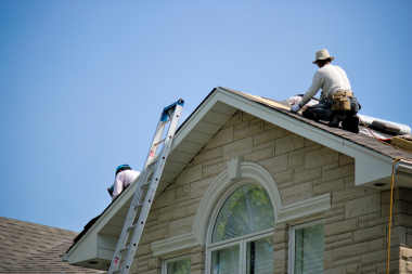how to address a roof leak if it happens roofing contractors with ladder completing inspection custom built michigan