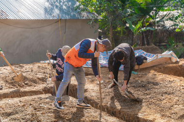 what to expect during a home addition project construction crew digging foundation custom built michigan