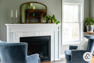 what to expect during a home addition project sunroom with fireplace and armchairs custom built michigan