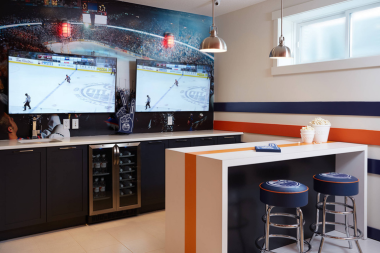top home remodeling ideas for sports fans hockey themed bar with refrigerator and tvs custom built michigan