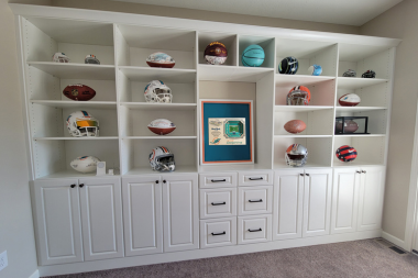 top home remodeling ideas for sports fans integrated storage with shelving and sports memorabilia custom built michigan