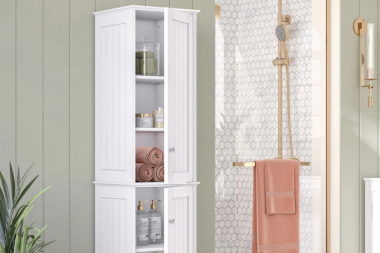 top storage ideas for your bathroom remodel tall wood linen cabinet next to shower with gold finishes custom built michigan