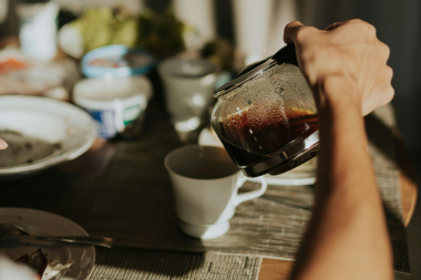 what living without a kitchen is really like during a remodeling project homeowner pouring breakfast coffee custom built michigan