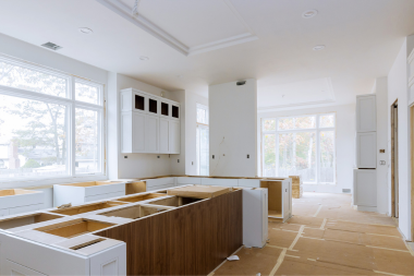 what living without a kitchen is really like during a remodeling project construction site with unfinished island custom built michigan