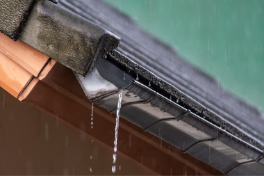 why roofing inspections are critical to ensuring the longevity of your roof rainy running off gutters custom built michigan