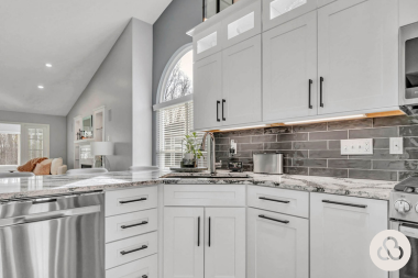 how to decide where to put features in your kitchen remodeling project sink area with subway tile backsplash and white cabinets custom built michigan