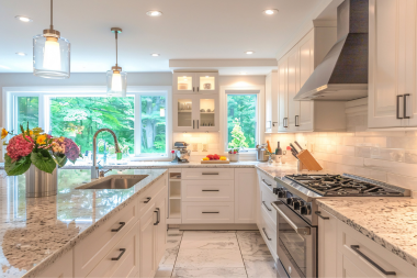 how to decide where to put features in your kitchen remodeling project layered lighting with recessed and pendant light fixtures custom built michigan