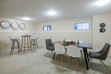 basement remodeling project in Greater Lansing with dining tables
