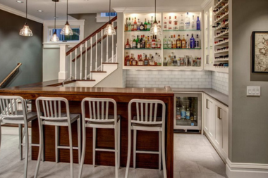 finished basement remodeling project with wet bar and pendant lighting in Greater Lansing Michigan