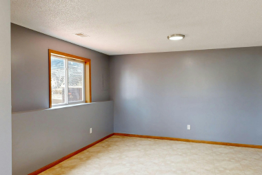 basement remodeling project with egress window and recessed lighting in Greater Lansing
