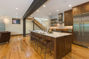 large basement remodeling project with wet bar and island in Greater Lansing\