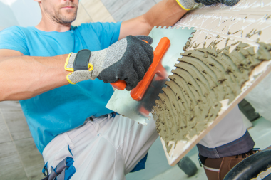 Greater Lansing home remodeling contractor installing bathroom tile