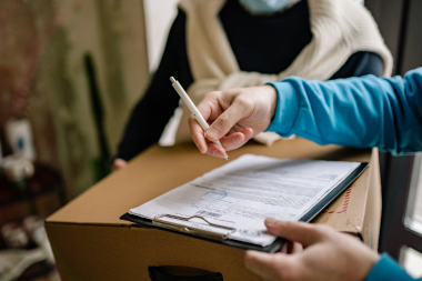 Greater Lansing home remodeling contractor with clipboard and scope