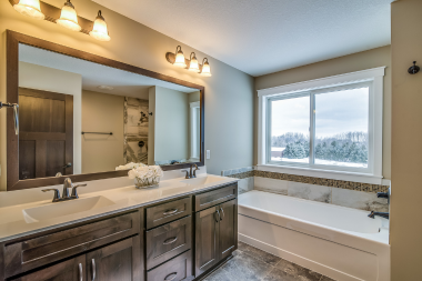 Northern Michigan bathroom remodeling project with double vanity and attached tub