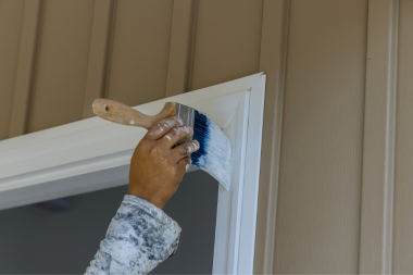 Greater Lansing window replacement contractor painting frame