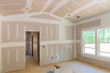 Greater Lansing home remodeling project with unfinished walls and windows