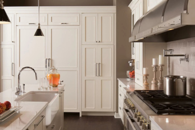 luxury kitchen in Greater Lansing with tall cabinets and large island
