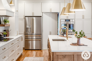 luxury kitchen remodel built in Greater Lansing by Custom Built with tall hidden cabinet pantry and modern appliances