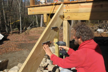 deck builder in Michigan drilling composite decking stairs