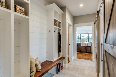 basement remodeling project in Northern Michigan lakehouse with mudroom and sliding barn doors