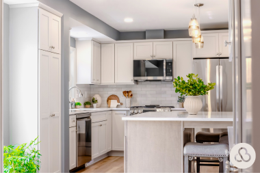 luxury kitchen remodeling project in Greater Lansing Michigan built by Custom Built Design and Remodeling with white subway tile backsplash and pendant lighting