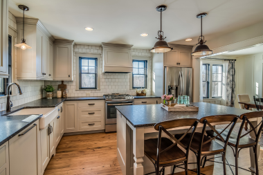 large kitchen remodeling project with pendant lighting in Greater Lansing