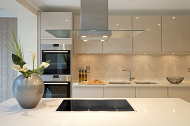 modern kitchen remodeling project with modern hood vent and induction cooktop