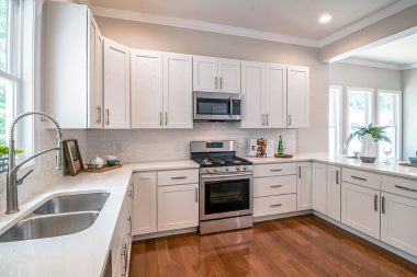 Greater Lansing kitchen remodeling project with hardwood flooring and white oak cabinetry