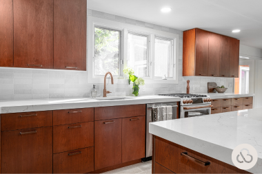 luxury kitchen remodeling project built by Custom Built Design and Remodeling with refaced cabinetry and subway tile backsplash