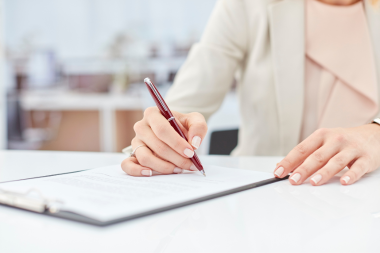 Greater Lansing homeowner signing fixed price agreement