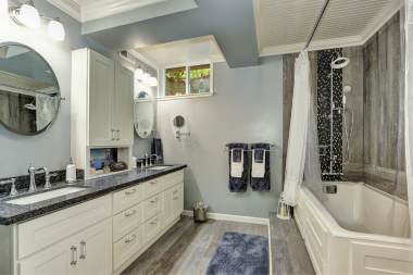 Greater Lansing basement bathroom remodeling project with double vanity and shower tub combo
