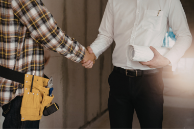 Greater Lansing kitchen remodeling contractor and homeowner shaking hands