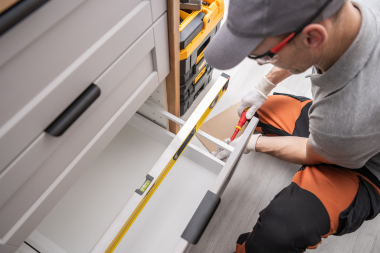 Greater Lansing kitchen remodeling contractor installing drawers