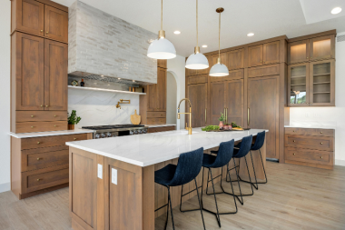 Greater Lansing luxury kitchen remodeling project with tall cabinets and custom hood vent