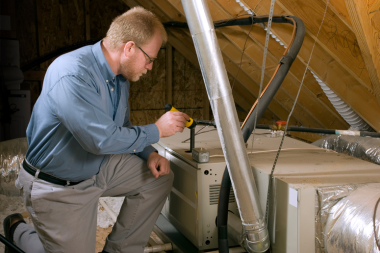 how home remodeling inspections work inspector checking attic hvac system custom built michigan