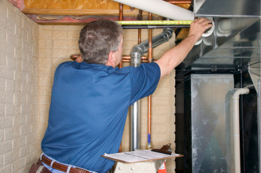 how home remodeling inspections work inspector checking basement plumbing pipes custom built michigan