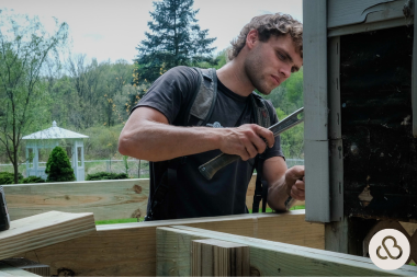 how home remodeling inspections work deck builder hammering nail into post custom built michigan