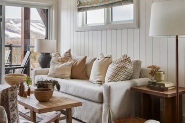 sunroom addition cost vs roi is it a smart investment four seasons room with shiplap walls and large sofa custom built michigan