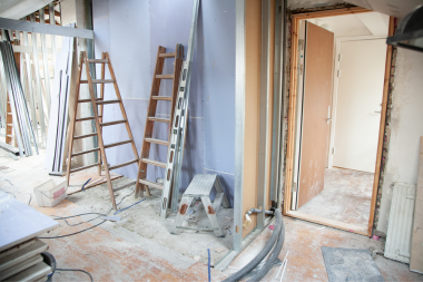 mistakes that can derail a home remodel before it starts construction jobsite with ladders custom built michigan