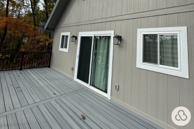 how we resolved an unforeseen change order during a deck project elevated decking area with sliding glass door custom built michigan